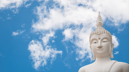 Fototapeta na wymiar Old buddha statue on Clouds and blue sky background.