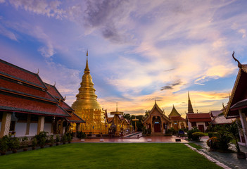 Fototapeta na wymiar Wat Phra That Hariphunchai with Twilight time in Lamphun Province, Thailand. Most famous temple in northern of Thailand.