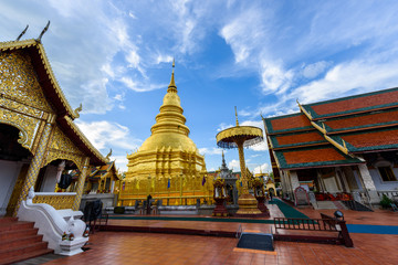 Fototapeta premium Wat Phra That Hariphunchai with blue sky in Lamphun Province, Thailand. Most famous temple in northern of Thailand.