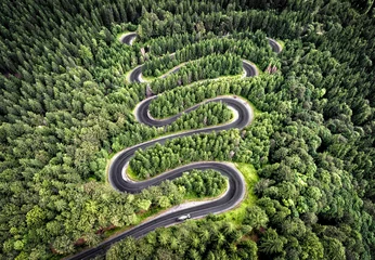 Foto op Canvas Winding road in the forest © Calin Stan