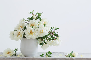 white roses in vase