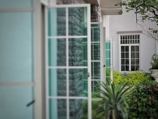 Modern white residential window. Window open to the garden. Home interior design.