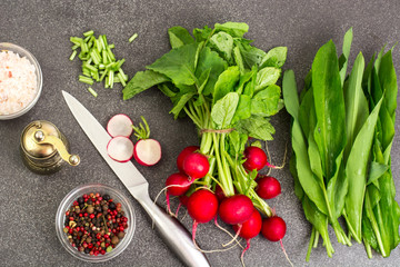 Spring greens radishes and wild garlic, sliced for vegetarian sa