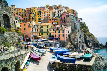 The small fishermen village of Manarola, with its little fishing port and its colorful houses...