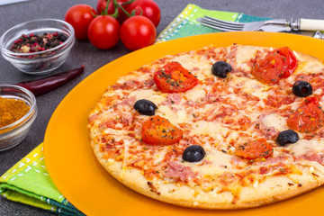 Homemade pizza with ham, cheese and mozzarella