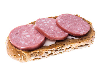 Sandwich of multi-grain bread with salami sausage