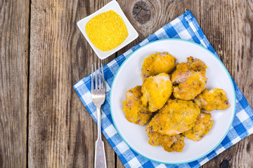 Pieces of chicken fillet, fried in corn breadcrumbs