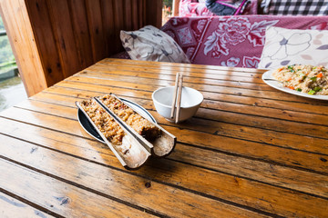 Fototapeta na wymiar fried rice served in bamboo trunk