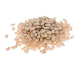 Peeled pine nuts on white background