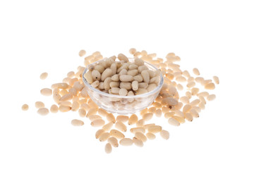 Peeled pine nuts on white background
