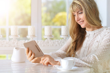 Young woman using digital tablet