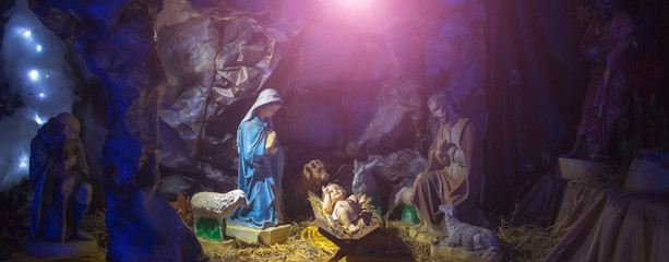 Nativity scene with figurines of Jesus, Mary, Joseph, sheep, magi