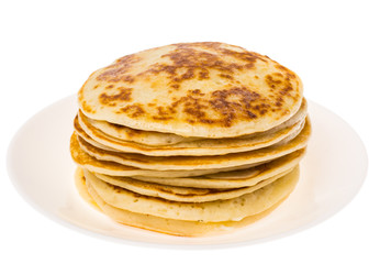 Stack of fried vanilla pancakes on plate on white background