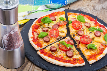 Crispy hot pizza on old wooden table