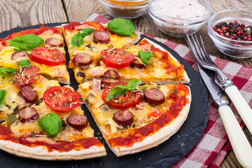 Crispy hot pizza on old wooden table