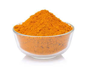 dry turmeric powder in white bowl isolated on white background