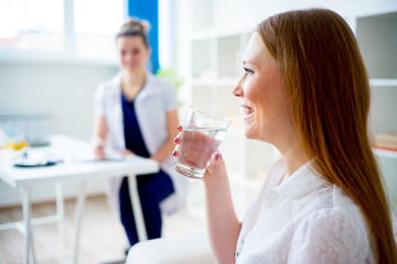 Pregnant woman drinking water