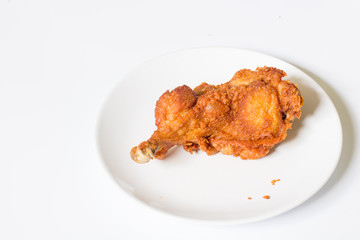 crispy  fried chicken in  the white dish on a wooden table , close up delicious fried chicken , close up