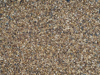 Brown small pebbles stone in the garden abstract background.