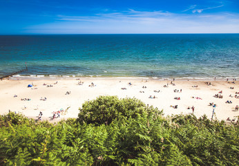 british seaside - summer holiday destination - top view of people on the beach in Bournemouth, Dorset, UK