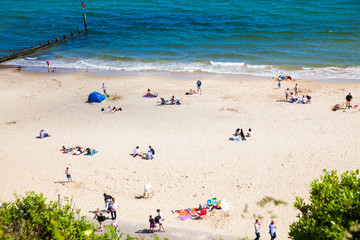 Fototapeta na wymiar british seaside - summer holiday destination - top view of people on the beach in Bournemouth, Dorset, UK