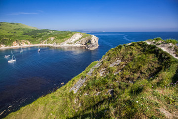 Fototapeta premium british seaside - summer holiday destination - Lulworth cove on Jurassic coast in southern Devon, UK
