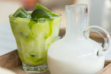 Green tea ice cubes with milk.