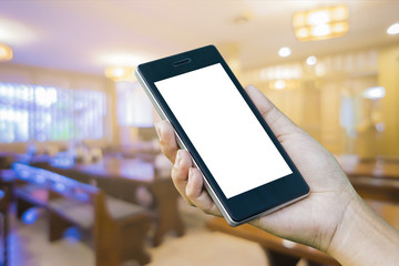 Women ’s Hand holding smart phone with food online device on screen over blur  japanese restaurant background, food online, food delivery concept.