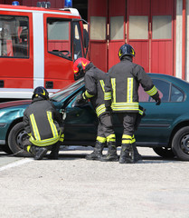 Firefighters during rescue after road accident