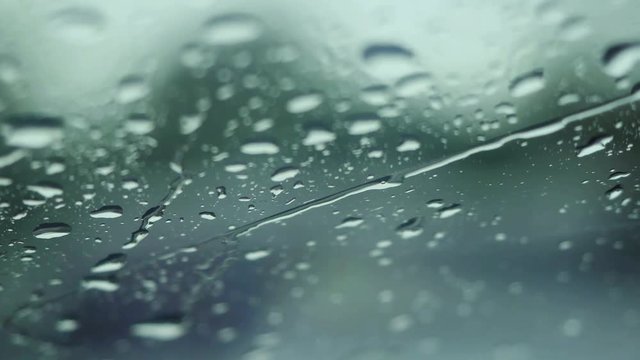 Rain falling on glass during rain storm. 3840x2160