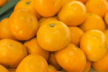 oranges fruit on market stall,with chinese new year background, in market,selective focus.