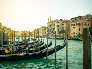 Fototapeta na wymiar Gondolas parks on canal in Venice, Italy