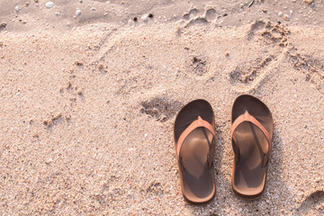 Fototapeta na wymiar slippers on the beach
