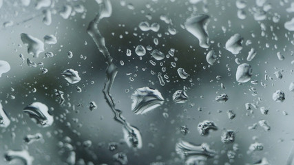 Rain falling on glass during rain storm