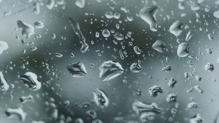 Rain falling on glass during rain storm