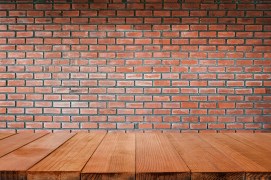 Wood table top with stone brick wall background,retro color - can be used for montage or display your products