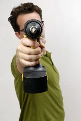 Fototapeta premium A Man with a cordless screwdriver