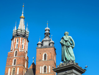 Fototapeta na wymiar Amazing view with Saint Mary´s Church in the Rynek Glowny ,Market Main Square in Krakov, Poland, Europe