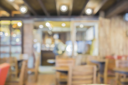 Blur or Defocus image of Coffee Shop or Cafeteria ,Customer at restaurant blur background with bokeh for use as Background,vintage retro color