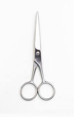 Professional scissors for haircuts isolated on white.