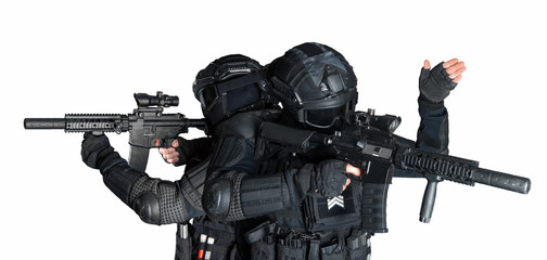 Members of the SWAT squad with an assault rifle in a black uniform on white background. Special...