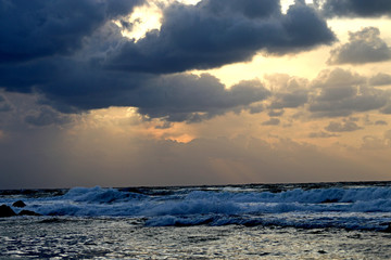 Stormy clouds in the sky at sunset