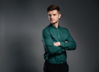 Serious man with arms crossed.