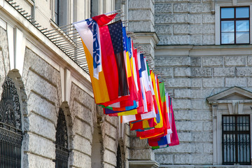 Vienna, Austria - international set of flags decorate a Hofburg palace 