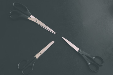Stationery scissors on a dark background
