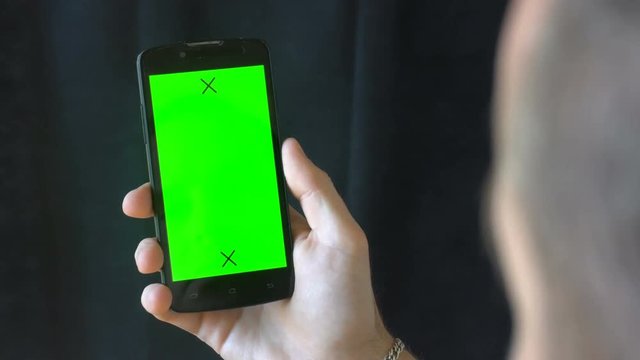 Close-up of male hands touching of smartphone. Green screen Chroma Key. Close up. Tracking motion. Vertical. pants. - Swipe left right animation black 6.
