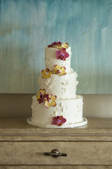 Three tier wedding cake with orchids