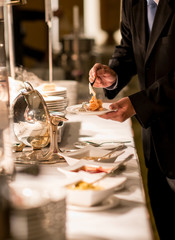 hands taking food