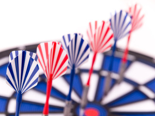 Six blue and red darts successively in dartboard