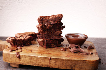 Brownie stack, chocolate cake on rustic wooden board